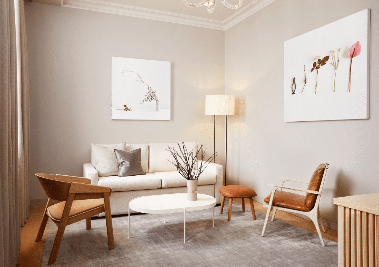 A modern living room with a light gray rug, wooden furniture, and a sense of tranquility.